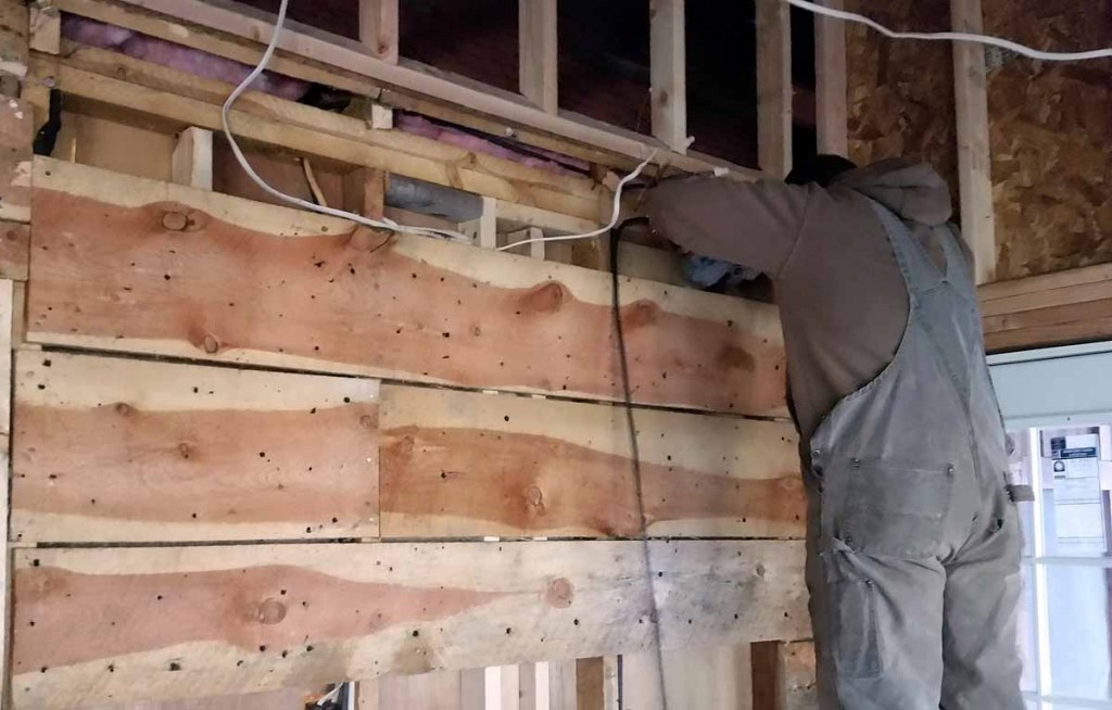 ​The wall area where Jon is working (down lower) would be ideal for a heater on the kitchen side and one on the bedroom hallway side.  The kitchen inside wall is now about ten feet high.  Tom will install a shelf similar to what we have in our living room above the cabinets.  Jon is fixing some of the older accessible existing wire while he is fixing the kitchen. 