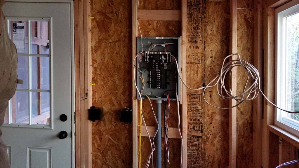  This is what the panel box looks like. Jon successfully removed the old panel box and installed this new one. He is now figuring out the wiring scheme of the cabin which was done over many years and straightening out some rather nasty problems (no grounding, overloaded boxes, way too much load on some circuits, old worn out wires, etc.) He is also going to install some smoke alarms in the bedroom areas which would be a nice safety feature as it would be hard to get out of the upstairs if there were ever a fire.